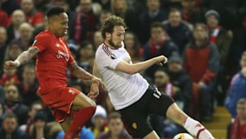 LIVERPOOL, ENGLAND - MARCH 10: Daley Blind of Manchester United in action with Nathaniel Clyne of Liverpool during the UEFA Europa League round of 16 first leg match between Liverpool and Manchester United at Anfield on March 10, 2016 in Liverpool, United Kingdom. (Photo by John Peters/Man Utd via Getty Images)