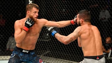 ABU DHABI, UNITED ARAB EMIRATES - JULY 16: (L-R) Calvin Kattar punches Dan Ige in their featherweight fight during the UFC Fight Night event inside Flash Forum on UFC Fight Island on July 16, 2020 in Yas Island, Abu Dhabi, United Arab Emirates. (Photo by Jeff Bottari/Zuffa LLC via Getty Images)