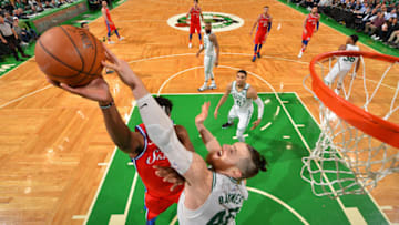 BOSTON, MA - APRIL 28: Joel Embiid #21 of the Philadelphia 76ers shoots the ball against Aron Baynes #46 of the Boston Celtics in Game One of the Eastern Conference Semifinals of the 2018 NBA Playoffs on April 30, 2018 at the TD Garden in Boston, Massachusetts. NOTE TO USER: User expressly acknowledges and agrees that, by downloading and or using this photograph, User is consenting to the terms and conditions of the Getty Images License Agreement. Mandatory Copyright Notice: Copyright 2018 NBAE (Photo by Jesse D. Garrabrant/NBAE via Getty Images)