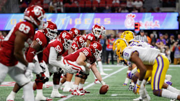 ATLANTA, GEORGIA - DECEMBER 28: Creed Humphrey #56 of the Oklahoma Sooners prepares to snap the ball at the line of scrimmage against the LSU Tigers during the Chick-fil-A Peach Bowl at Mercedes-Benz Stadium on December 28, 2019 in Atlanta, Georgia. (Photo by Kevin C. Cox/Getty Images)
