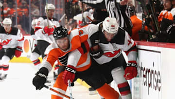 PHILADELPHIA, PENNSYLVANIA - OCTOBER 09: Ivan Provorov #9 of the Philadelphia Flyers and Miles Wood #44 of the New Jersey Devils battle for position during the first period at the Wells Fargo Center on October 09, 2019 in Philadelphia, Pennsylvania. (Photo by Bruce Bennett/Getty Images)
