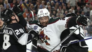 Arizona Coyotes' #24 Matt Dumba scuffles with Los Angeles Kings' #28 Jaret Anderson-Dolan (Photo by MARTIN KEEP/AFP via Getty Images)