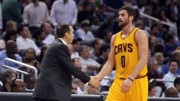 Dec 26, 2014; Orlando, FL, USA; Cleveland Cavaliers head coach David Blatt high fives forward Kevin Love (0) against the Orlando Magic during the first quarter at Amway Center. Mandatory Credit: Kim Klement-USA TODAY Sports