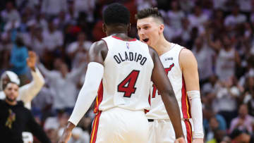 Tyler Herro #14 of the Miami Heat celebrates with Victor Oladipo #4 against the Philadelphia 76ers(Photo by Michael Reaves/Getty Images)