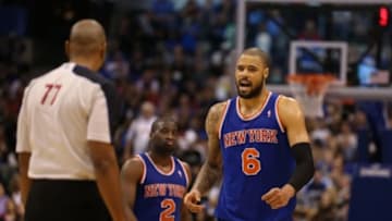 Nov 21, 2012; Dallas, TX, USA; New York Knicks center Tyson Chandler (6) argues a call with official Karl Lane (77) in the fourth quarter against the Dallas Mavericks at American Airlines Center. The Mavs beat the Knicks 114-111. Mandatory Credit: Matthew Emmons-USA TODAY Sports
