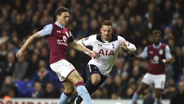 LONDON, ENGLAND - JANUARY 08: James Chester of Aston Villa (L) passes the ball while under pressure from Vincent Janssen of Tottenham Hotspur (R) during The Emirates FA Cup Third Round match between Tottenham Hotspur and Aston Villa at White Hart Lane on January 8, 2017 in London, England. (Photo by Julian Finney/Getty Images)