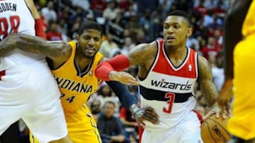 May 11, 2014; Washington, DC, USA; Washington Wizards shooting guard Bradley Beal (3) dribbles the ball as Indiana Pacers small forward Paul George (24) defends during the second half in game four of the second round of the 2014 NBA Playoffs at Verizon Center. The Pacers won 95-92. Mandatory Credit: Brad Mills-USA TODAY Sports