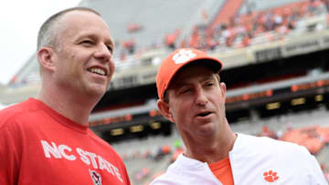 CLEMSON, SC - OCTOBER 20: Head coach Dabo Swinney of the Clemson Tigers and head coach Dave Doeren of the North Carolina State Wolfpack chat at midfield prior to their football game at Clemson Memorial Stadium on October 20, 2018 in Clemson, South Carolina. (Photo by Mike Comer/Getty Images)