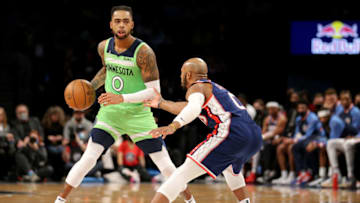 Dec 3, 2021; Brooklyn, New York, USA; Minnesota Timberwolves guard D'Angelo Russell (0) controls the ball against Brooklyn Nets guard Jevon Carter (0) during the second quarter at Barclays Center. Mandatory Credit: Brad Penner-USA TODAY Sports