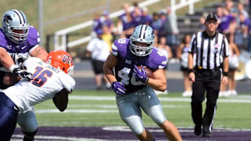 Sep 27, 2014; Manhattan, KS, USA; Kansas State Wildcats fullback Glenn Gronkowski (48) looks for room to run against UTEP Miners linebacker Alvin Jones (16) during the Wildcats