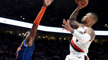 Damian Lillard, Jerami Grant, OKC Thunder . (Photo by Steve Dykes/Getty Images)