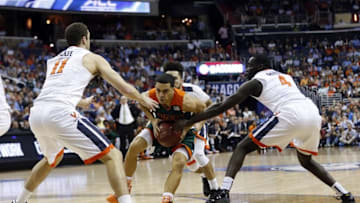 Mar 11, 2016; Washington, DC, USA; Miami Hurricanes guard Angel Rodriguez (13) dribbles the ball as Virginia Cavaliers forward Evan Nolte (11) and Cavaliers guard Marial Shayok (4) defend in the first half during the semi-finals of the ACC Conference tournament at Verizon Center. Mandatory Credit: Geoff Burke-USA TODAY Sports