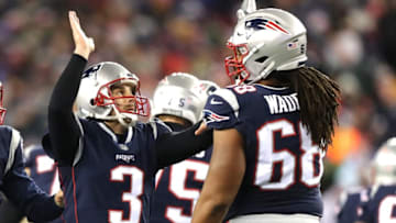 FOXBOROUGH, MA - JANUARY 13: Stephen Gostkowski #3 of the New England Patriots high fives LaAdrian Waddle #68 in the second quarter of the AFC Divisional Playoff game against the Tennessee Titans at Gillette Stadium on January 13, 2018 in Foxborough, Massachusetts. (Photo by Elsa/Getty Images)