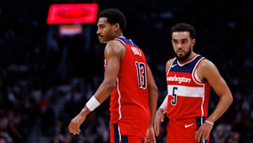 TORONTO, CANADA - OCTOBER 20: Jordan Poole #13 and Tyus Jones #5 of the Washington Wizards walk the court during the first half of their NBA game against the Toronto Raptors at Scotiabank Arena on October 20, 2023 in Toronto, Canada. NOTE TO USER: User expressly acknowledges and agrees that, by downloading and or using this photograph, User is consenting to the terms and conditions of the Getty Images License Agreement. (Photo by Cole Burston/Getty Images)