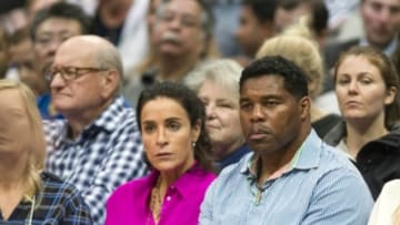 Mar 30, 2016; Dallas, TX, USA; Former NFL running back Herschel Walker watches the game between the Dallas Mavericks and the New York Knicks during the first half at the American Airlines Center. Mandatory Credit: Jerome Miron-USA TODAY Sports