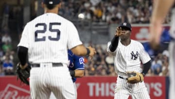 NEW YORK, NY - AUGUST 10: Didi Gregorius #18 of the New York Yankees attempts to flick the ball to Gleyber Torres #25 of the New York Yankees during a rundown in the sixth inning against the Texas Rangers during their game at Yankee Stadium on August 10, 2018 in New York City. (Photo by Michael Owens/Getty Images)