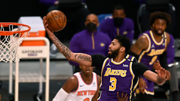 LOS ANGELES, CALIFORNIA - MAY 11: Anthony Davis #3 of the Los Angeles Lakers attempts a layup between Julius Randle #30 and Reggie Bullock #25 of the New York Knicks during the first quarter at Staples Center on May 11, 2021 in Los Angeles, California. (Photo by Harry How/Getty Images) NOTE TO USER: User expressly acknowledges and agrees that, by downloading and or using this photograph, User is consenting to the terms and conditions of the Getty Images License Agreement.