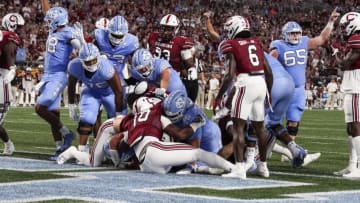 Sep 2, 2023; Charlotte, North Carolina, USA; North Carolina Tar Heels running back Omarion Hampton (28) scores the opening touchdown against the South Carolina Gamecocks during the first quarter at Bank of America Stadium. Mandatory Credit: Jim Dedmon-USA TODAY Sports