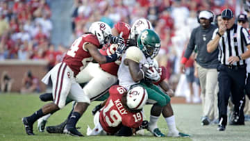 NORMAN, OK - SEPTEMBER 29: Running back Jamycal Hasty #6 of the Baylor Bears is pushed out of bounds by the Oklahoma Sooners at Gaylord Family Oklahoma Memorial Stadium on September 29, 2018 in Norman, Oklahoma. Oklahoma defeated Baylor 66-33. (Photo by Brett Deering/Getty Images)