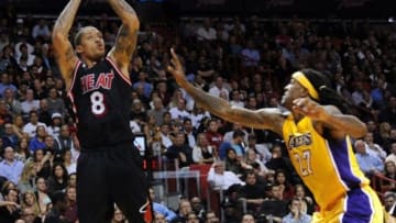 Jan 23, 2014; Miami, FL, USA; Miami Heat small forward Michael Beasley (8) shoots over Los Angeles Lakers power forward Jordan Hill (27) during the second half at American Airlines Arena. Mandatory Credit: Steve Mitchell-USA TODAY Sports