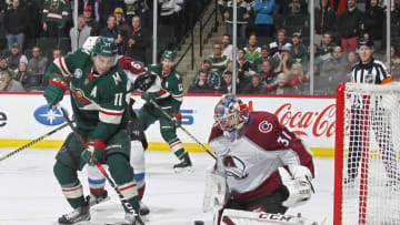 ST. PAUL, MN - MARCH 19: Philipp Grubauer #31 of the Colorado Avalanche makes a save behind Zach Parise #11 of the Minnesota Wild during a game at Xcel Energy Center on March 19, 2019 in St. Paul, Minnesota.(Photo by Bruce Kluckhohn/NHLI via Getty Images)