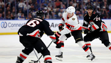 Apr 13, 2023; Buffalo, New York, USA; Ottawa Senators left wing Tim Stützle (18) skates with the puck as Buffalo Sabres defenseman Ilya Lyubushkin (46) defends during the first period at KeyBank Center. Mandatory Credit: Timothy T. Ludwig-USA TODAY Sports
