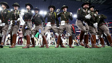 ARLINGTON, TEXAS - SEPTEMBER 24: Members of the Texas A&M Corps of Cadets sing as the Texas A&M Aggies take on the Arkansas Razorbacks in the fourth quarter of the 2022 Southwest Classic at AT&T Stadium on September 24, 2022 in Arlington, Texas. (Photo by Tom Pennington/Getty Images)