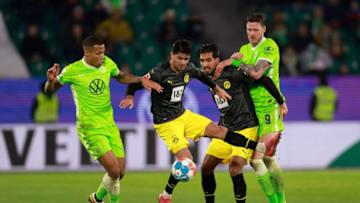 Mahmoud Dahoud and Emre Can (2R) vie for the ball (Photo by ODD ANDERSEN/AFP via Getty Images)