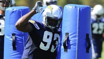 Jul 25, 2013; San Diego, CA, USA; San Diego Chargers outside linebacker Dwight Freeney (93) hits a blocking bag during linebacker drills at training camp at Chargers Park. Mandatory Credit: Christopher Hanewinckel-USA TODAY Sports
