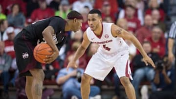 Jan 9, 2016; Fayetteville, AR, USA; Arkansas Razorbacks guard Jabril Durham (4) defends against Mississippi State Bulldogs guard Craig Sword (32) during the first half at Bud Walton Arena. Arkansas won 82-68. Mandatory Credit: Brett Rojo-USA TODAY Sports