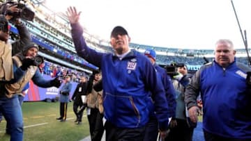 Jan 3, 2016; East Rutherford, NJ, USA; New York Giants head coach Tom Coughlin (C) waves to fans while walking off the field after the game against the Philadelphia Eagles at MetLife Stadium. The Eagles won 35-30. Mandatory Credit: Brad Penner-USA TODAY Sports