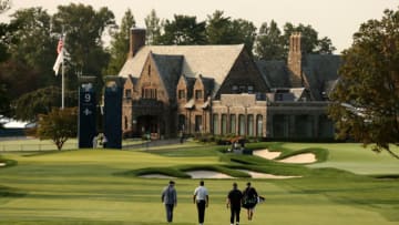 MAMARONECK, NEW YORK - SEPTEMBER 16: Tiger Woods of the United States walks to his approach shot on the ninth hole as the clubhouse is seen during a practice round prior to the 120th U.S. Open Championship on September 16, 2020 at Winged Foot Golf Club in Mamaroneck, New York. (Photo by Gregory Shamus/Getty Images)
