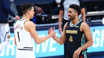 Michael Porter Jr. #1 of the Denver Nuggets and Jontay Porter #4 of the Memphis Grizzlies (Photo by C. Morgan Engel/Getty Images)