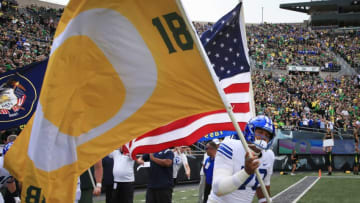 BYU players bring a tribute to Spencer Webb. (Syndication: The Register Guard)