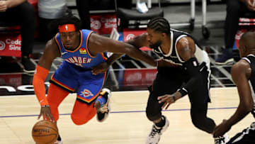 LOS ANGELES, CALIFORNIA - JANUARY 22: Luguentz Dort #5 of the Oklahoma City Thunder drives to the basket while defended by Paul George #13 of the Los Angeles Clippers during the first quarter at Staples Center on January 22, 2021 in Los Angeles, California. NOTE TO USER: User expressly acknowledges and agrees that, by downloading and or using this Photograph, user is consenting to the terms and conditions of the Getty Images License Agreement. (Photo by Katelyn Mulcahy/Getty Images)