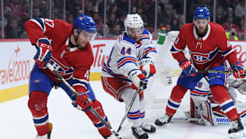 MONTREAL, QC - DECEMBER 1: Kenny Agostino #47 of the Montreal Canadiens controls the puck against Neal Pionk #44 of the New York Rangers in the NHL game at the Bell Centre on December 1, 2018 in Montreal, Quebec, Canada. (Photo by Francois Lacasse/NHLI via Getty Images)