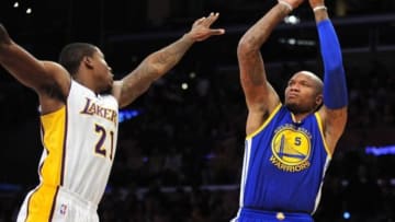 November 16, 2014; Los Angeles, CA, USA; Golden State Warriors forward Marreese Speights (5) shoots against the defense of Los Angeles Lakers forward Ed Davis (21) during the first half at Staples Center. Mandatory Credit: Gary A. Vasquez-USA TODAY Sports