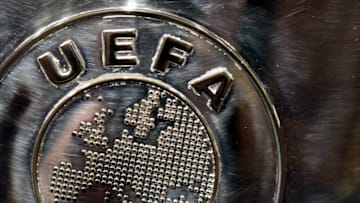 NYON, SWITZERLAND - JULY 18: The UEFA logo is seen on the UEFA Champions League trophy as it is prepared for the UEFA 2014/15 Champions League third qualifying rounds draw at the UEFA headquarters, The House of European Football, on July 18, 2014 in Nyon, Switzerland. (Photo by Harold Cunningham/Getty Images for UEFA)