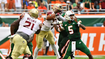 MIAMI, FL - OCTOBER 06: Brian Burns #99 of the Florida State Seminoles causes a fumble by N'Kosi Perry #5 of the Miami Hurricanes in the first half at Hard Rock Stadium on October 6, 2018 in Miami, Florida. (Photo by Mark Brown/Getty Images)