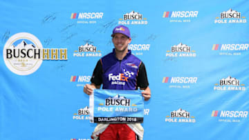 DARLINGTON, SC - SEPTEMBER 01: Denny Hamlin, driver of the #11 FedEx Throwback Toyota, poses with the Busch Pole Award after qualying on the pole position during qualifying for the Monster Energy NASCAR Cup Series Bojangles' Southern 500 at Darlington Raceway on September 1, 2018 in Darlington, South Carolina. (Photo by Josh Hedges/Getty Images)