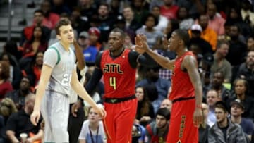Nov 24, 2015; Atlanta, GA, USA; Atlanta Hawks forward Paul Millsap (4) celebrates a play with guard Lamar Patterson (13) as Boston Celtics guard R.J. Hunter (28) is shown in the third quarter of their game at Philips Arena. The Hawks won 121-97. Mandatory Credit: Jason Getz-USA TODAY Sports