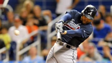 Sep 25, 2015; Miami, FL, USA; Atlanta Braves first baseman Freddie Freeman (5) connects for a base hit during the first inning against the Miami Marlins at Marlins Park. Mandatory Credit: Steve Mitchell-USA TODAY Sports