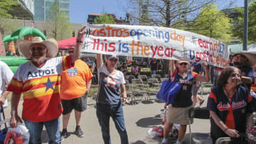 HOUSTON, TX - APRIL 03: Fans carry signs during Houston Astros Fan Fest before playing the Seattle Mariners on opening day at Minute Maid Park on April 3, 2017 in Houston, Texas. (Photo by Bob Levey/Getty Images)