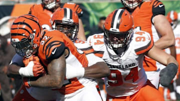 Oct 23, 2016; Cincinnati, OH, USA; Cincinnati Bengals running back Jeremy Hill (32) runs against Cleveland Browns outside linebacker Emmanuel Ogbah (90) and defensive end Carl Nassib (94) during the second half at Paul Brown Stadium. The Bengals won 31-17. Mandatory Credit: David Kohl-USA TODAY Sports