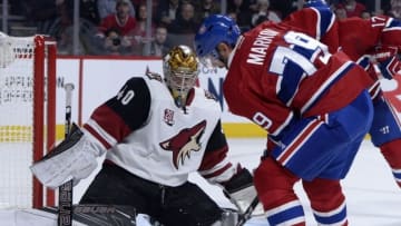 Oct 20, 2016; Montreal, Quebec, CAN; Arizona Coyotes goalie Justin Peters (40) stops a shot from Montreal Canadiens defenseman Andrei Markov (79) during the second period at the Bell Centre. Mandatory Credit: Eric Bolte-USA TODAY Sports