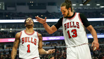 Chicago Bulls guard Derrick Rose (1) and Chicago Bulls center Joakim Noah (13), after Rose was fouled, during the first half on Monday, Feb. 23, 2015, at the United Center in Chicago. (Nuccio DiNuzzo/Chicago Tribune/TNS via Getty Images)