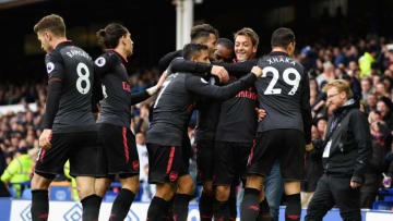 LIVERPOOL, ENGLAND - OCTOBER 22: Mesut Ozil of Arsenal scores his sides second goal with his Arsenal team mates during the Premier League match between Everton and Arsenal at Goodison Park on October 22, 2017 in Liverpool, England. (Photo by Gareth Copley/Getty Images)