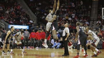 Dec 19, 2015; Houston, TX, USA; Houston Rockets center Dwight Howard (12) jumps against Los Angeles Clippers center DeAndre Jordan (6) on the opening tip off in the first quarter at Toyota Center. Mandatory Credit: Thomas B. Shea-USA TODAY Sports