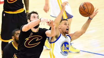 Jun 13, 2016; Oakland, CA, USA; Golden State Warriors guard Stephen Curry (30) and Cleveland Cavaliers forward Kevin Love (0) go after a loose ball during the fourth quarter in game five of the NBA Finals at Oracle Arena. Mandatory Credit: Bob Donnan-USA TODAY Sports