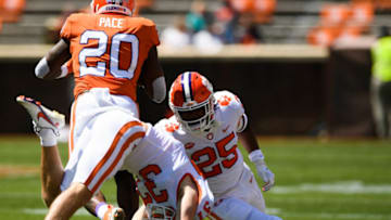 Apr 3, 2021; Clemson, South Carolina, USA; Clemson running back Kobe Pace (20) attempts to push past safety Jake Herbstreit (37) and safety Jalyn Phillips (25) during their annual spring game at Memorial Stadium. Mandatory Credit: Ken Ruinard-USA TODAY Sports